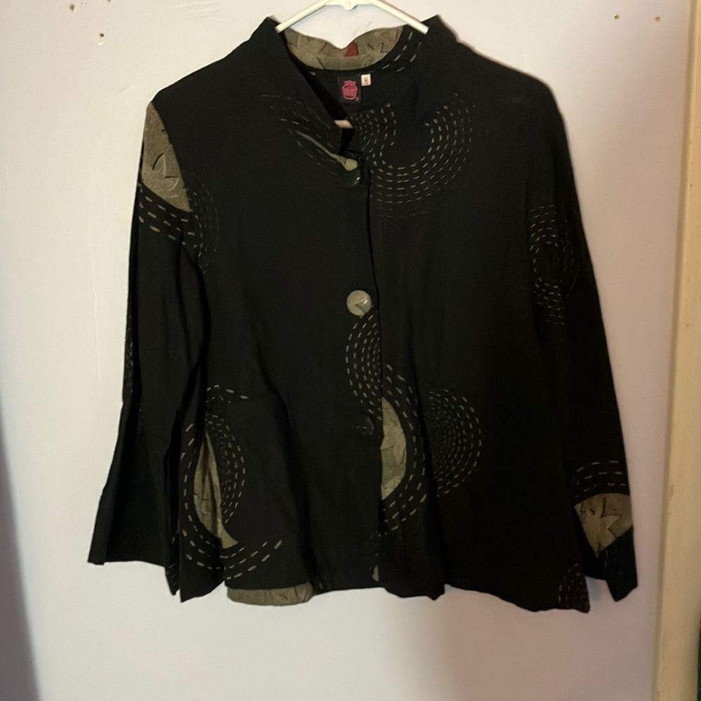 Fashionable black jacket with swirls